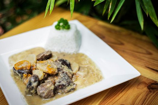 organic beef and sauerkraut cream vegetable stew on wooden table