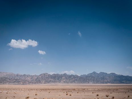 dry desert landscape view near yazd in southern iran on sunny day