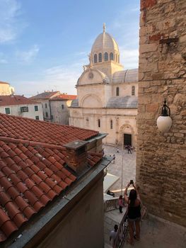 Tourist photgraphs the Cathedral of St. James in Sibenik, Croatia