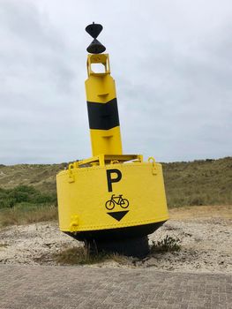 Buoy as sign to park your bicycle on Terschelling The Netherlands