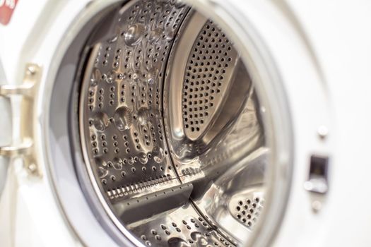 Drum of washing machine dry and clean close-up.Washing Dryer Machine inside view of a drum.