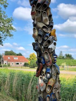 Wooden shoes on a tree in Bontebok, Friesland The Netherlands