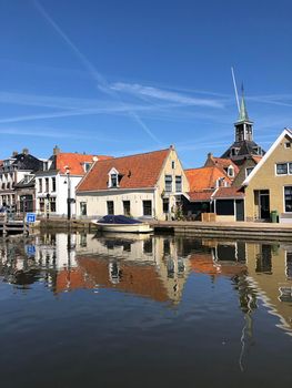 Houses next to a canal in the old town of Makkum, Friesland, The Netherlands