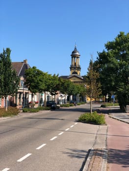 Street towards the the big church in Sint Jacobiparochie, Friesland The Netherlands