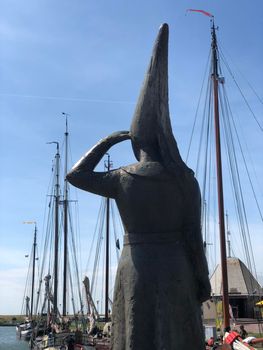 Lady of Stavoren statue in the harbor of Stavoren, Friesland The Netherlands