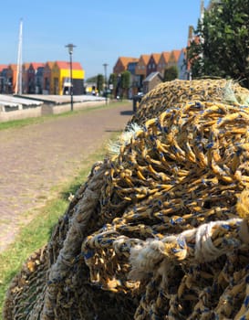 Fishing nets and colorful houses in Stavoren, Friesland The Netherlands