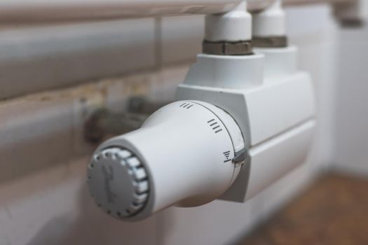 Close up picture of a heat regulator. Good indoor climate. On.
