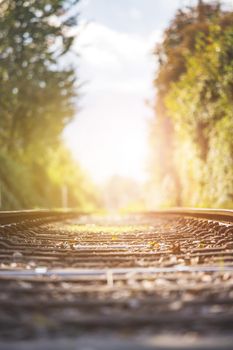 Landscape of an old abandoned railway in fall. Warm light, sustainable traveling