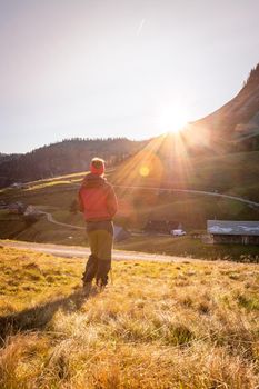 Woman in sportswear is enjoying the sunset in the mountains. Alpes, Austria