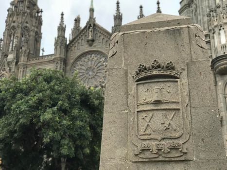 Pray and work (Ora et Labora) stone in front of the Parroquia de San Juan Bautista (Arucas cathedral) in Arucas Gran Canaria