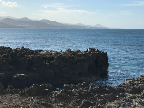 Man fishing on the rocks in Las Palmas Gran Canaria