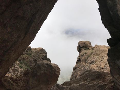 Seeing through the stones at the Roque Nublo a volcanic rock on the island of Gran Canaria