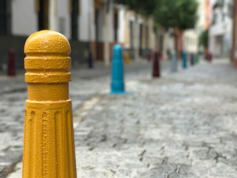 Colorful poles in the street of Seville Spain