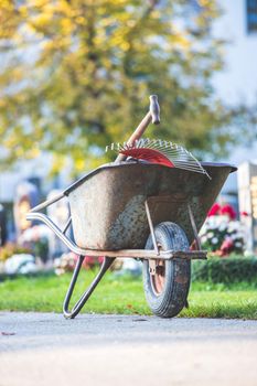 Close up of grey wheelbarrow in a park, gardening