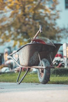 Close up of grey wheelbarrow in a park, gardening