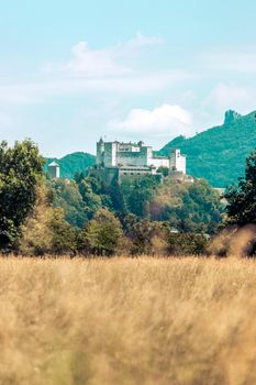 Fortress Hohensalzburg with mountains in the background, autumn time