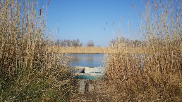 River with a boat in the Parc Natural del Delta de l'Ebre Spain