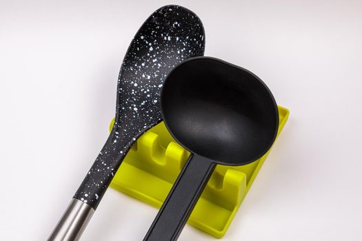 Stand, tray for large spoons, ladles, stirrers. Modern fittings in the kitchen. Convenient to prepare food.