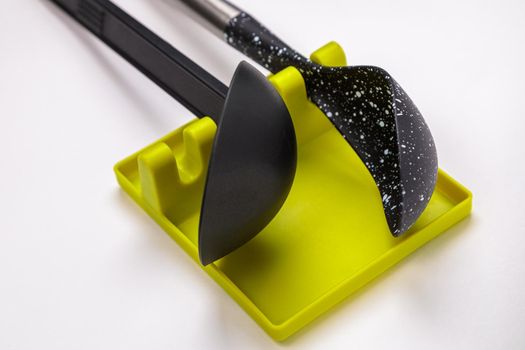 Stand, tray for large spoons, ladles, stirrers. Modern fittings in the kitchen. Convenient to prepare food.