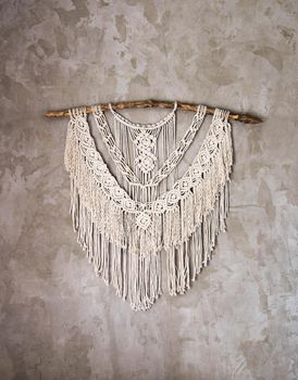 Wall panel in the style of Boho made of cotton threads in natural color using the macrame technique for home decor and wedding decoration. Beautiful boho macrame wall panel will add a cozy atmosphere and charm to any space in your home