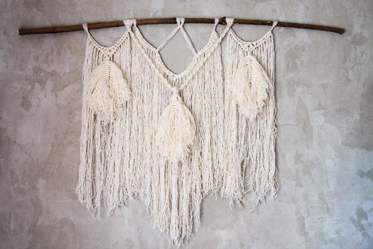 Wall panel in the style of Boho made of cotton threads in natural color using the macrame technique for home decor and wedding decoration. Beautiful boho macrame wall panel will add a cozy atmosphere and charm to any space in your home