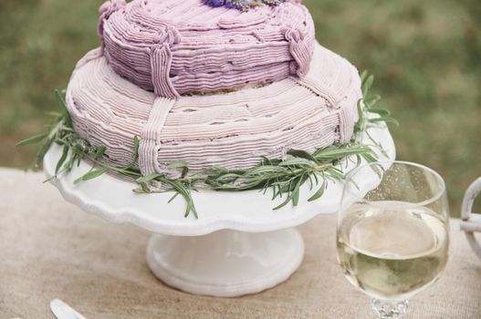 rustic style butter cake on a festive table with a glass of white wine