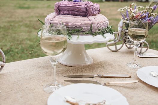 boho style wedding table with cake for bride and groom