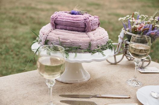 boho style wedding table with cake for bride and groom