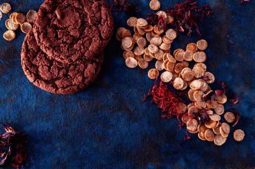 still life on a blue background with american dry crispy cookies and tangerines