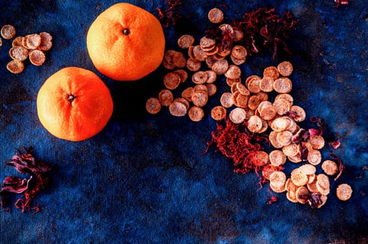 still life on a blue background with american dry crispy cookies and tangerines