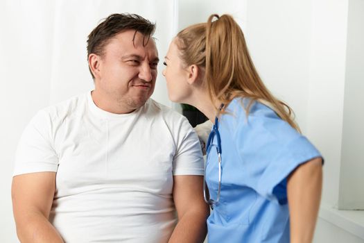 female doctor looking in the face patient emotion hospital. High quality photo