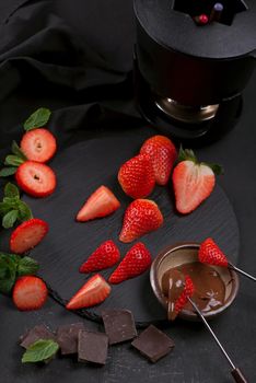 Composition with chocolate covered strawberries on grey background