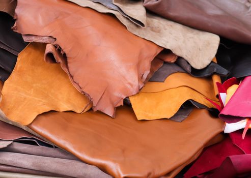 Detailed close up view on samples of cloth and fabrics in different colors found at a fabrics market.