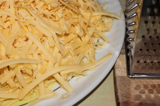 Close up of fresh chopped cheese as topping for a pizza