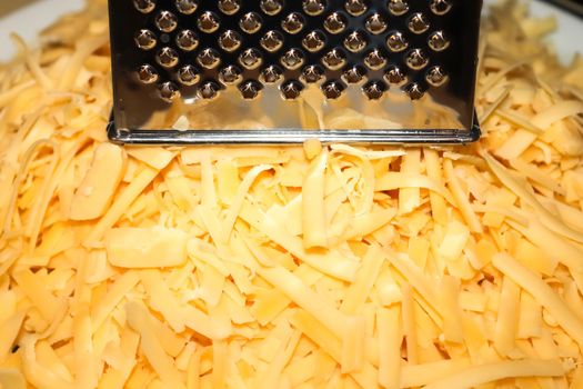 Close up of fresh chopped cheese as topping for a pizza