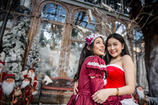 Young woman in red santa costume, Girl celebrates New Year 2021 in winter. Shopping black friday sale concept