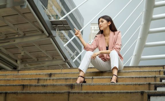 woman sitting on stairs