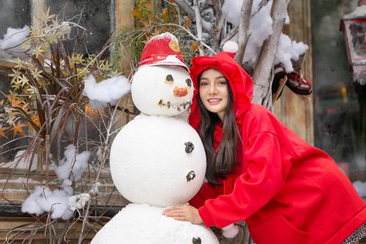 Young woman in red santa costume, Girl celebrates New Year 2021 in winter. Shopping black friday sale concept