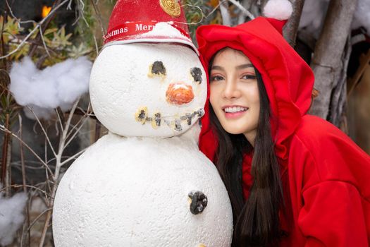 Young woman in red santa costume, Girl celebrates New Year 2021 in winter. Shopping black friday sale concept