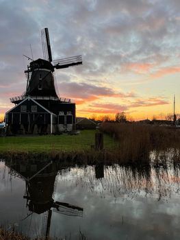 Windmill in IJlst during sunset in Friesland The Netherlands