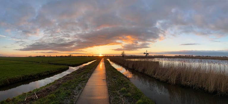 Sunset on a path towards IJlst in Friesland The Netherlands