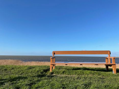 Bench at the dyke of the IJsselmeer around Gaast in Friesland, The Netherlands