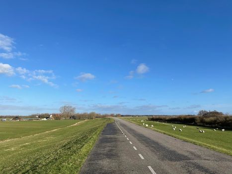 Road on a dyke around Laaksum in Friesland, The Netherlands