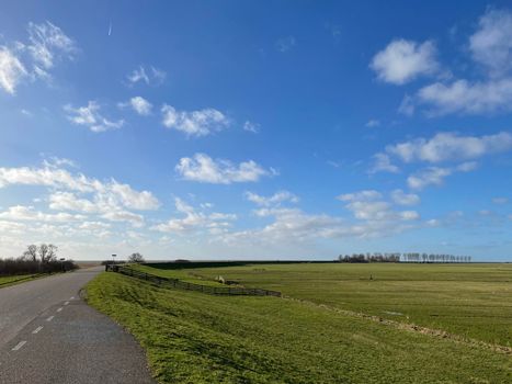 Road on a dyke around Laaksum in Friesland, The Netherlands