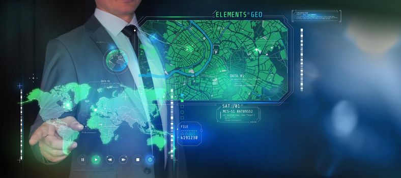 The man works with the virtual interface of geolocation programs.