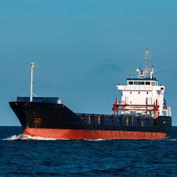 Black bulker ship. Logistics and merchandise transportations