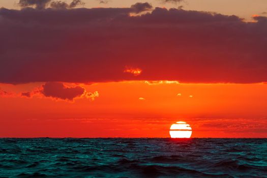 Hot and romantic sunset over the Baltic sea. Calm landscape