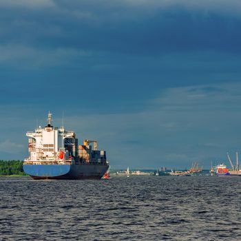 Blue container ship. World logistics and production transfer