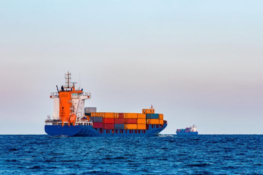 Blue container ship. Global logistics and merchandise transfer