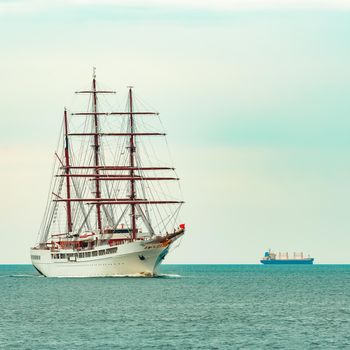 Big white sailing ship with three mast moving to the Riga port